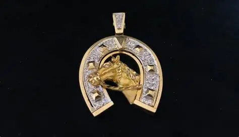 Gold horseshoe pendant with a horse head and diamond accents